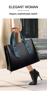 Dettaglio borsa tote in pelle nera con manici verde acqua e finiture in metallo oro