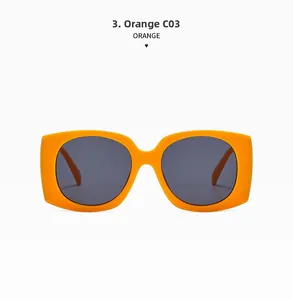 Front view of trendy orange oversized square sunglasses with dark grey lenses on white background
