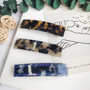 Three acetate leopard print hair clips in tortoiseshell patterns for women