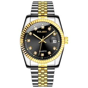 Close-up of luxury quartz watch with diamond markers, date window and two-tone steel band