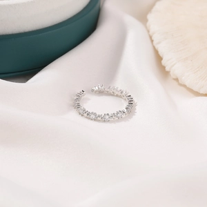 Silver open star ring with cubic zirconia on white silk, minimalist Korean jewelry