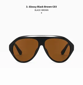 Détail de lunettes aviateur surdimensionnées avec monture noir brillant et verres bruns