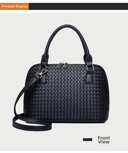 Detail showing premium black woven texture and gold metal buckle on Boston bag