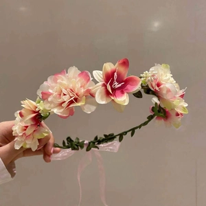 Handmade pink and white floral bridal crown with green vines and silk ribbons