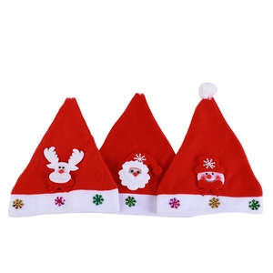 Three red felt Christmas hats with cartoon Santa Claus, reindeer and snowman patches