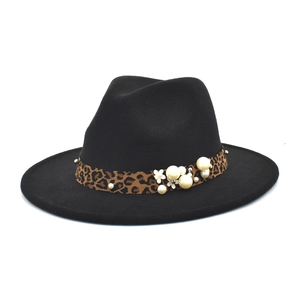 Detail of black wool fedora with leopard print band adorned with pearls and floral accents