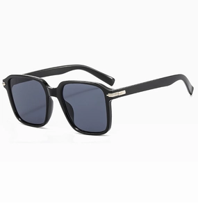 Macro shot of black square oversized sunglasses with silver metal temple detail