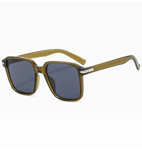 Detail view of translucent olive green sunglasses with silver metal decorative accents