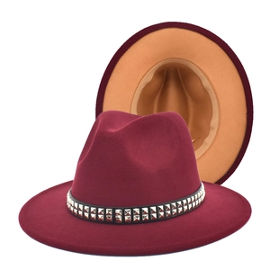 Detail of wool fedora with studded black ribbon showing high-quality felt texture and lining