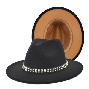 Detail of black wool fedora with gold metal studs and camel colored contrast underbrim