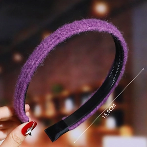 Detail showing a purple plush headband with black base measuring 15.5cm in diameter