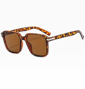 Close-up of vintage tortoiseshell square sunglasses with silver metal temple accents