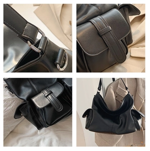 Detail of black PU leather shoulder bag with side pockets and metallic buckle hardware