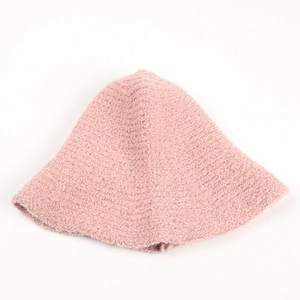 Detailed texture of pink plush knit bucket hat featuring soft sherpa fleece fabric