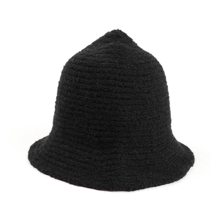 Detailed close-up of black textured knit fisherman hat with vintage pointed crown design
