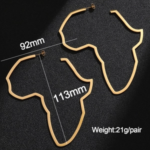 Detail view of large gold Africa map earrings with dimensions 113mm height and 92mm width