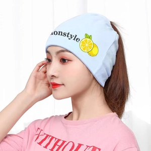 Detail of light blue maternity hat with lemon pattern and ponytail hole design