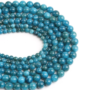 Natural blue apatite round beads in a gradient layout on white background