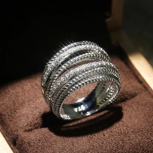 Macro detail of S925 sterling silver multi-layer ring with pavé cubic zirconia and twist texture