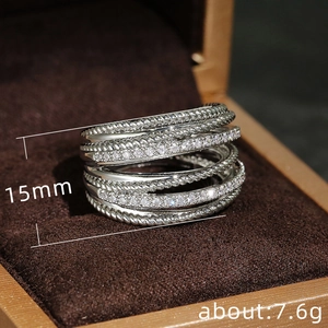 Micro-set zircon crossover ring in silver finish with twisted texture and 15mm width