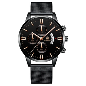 Macro detail of men's business watch featuring a black mesh strap and rose gold markers