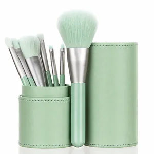 Portable 7-piece mint green makeup brush set with matching leather storage case