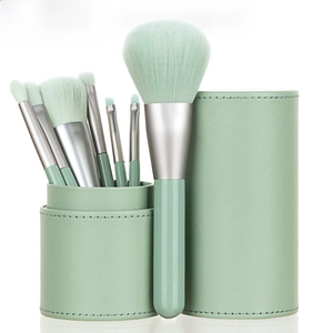 Portable 7-piece mint green makeup brush set with matching leather storage case