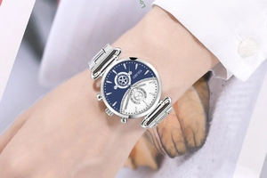 Detail shot of Yolako quartz watch featuring blue and white dial with silver metal strap