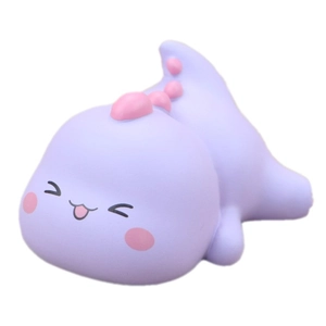 Cute purple dinosaur desk ornament made of soft material on a white background