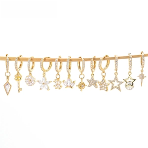 Collection of golden star and floral earrings featuring sparkling zircon stone detailing