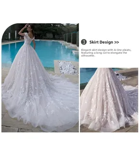 Detail of A-line wedding dress with floral lace appliques and long flowing train