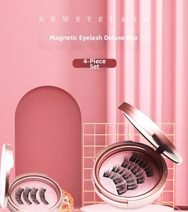 Detail view of 4 pieces of magnetic false eyelashes in a pink compact case with mirror