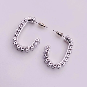 Elegant silver U-shaped hoop earrings with square cubic zirconia in a minimalist style