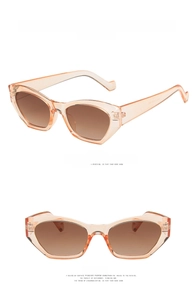 Irregular cat-eye sunglasses in transparent brown frame with gradient brown lenses detail