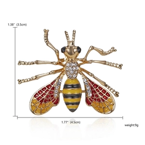 Detailed macro view showing the crystal inlay and enamel wings of the bee brooch