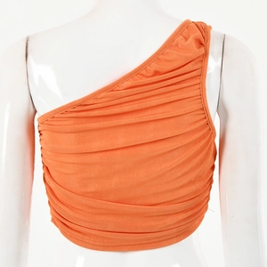 Detailed back view of orange one-shoulder cropped top with pleated texture on mannequin