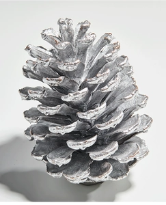 Detailed macro shot of silver-painted natural pinecone Christmas tree hanging ornament