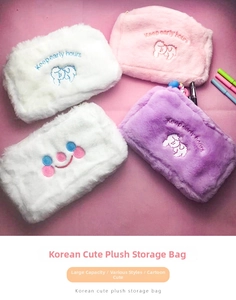 Detail of plush cartoon makeup bags with soft fur and cute character embroidery