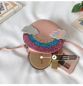 Detailed view of pink rainbow girls crossbody bag showing interior storage capacity