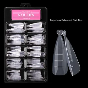 Detailed view of 100pcs clear nail extension tips with scale in a black storage box