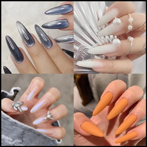 Long almond press-on nail set featuring cat-eye, gradient pearl, and 3D aurora bear designs