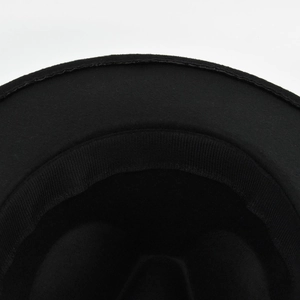 Detail view of inner sweatband and craftsmanship on a black wool fedora hat
