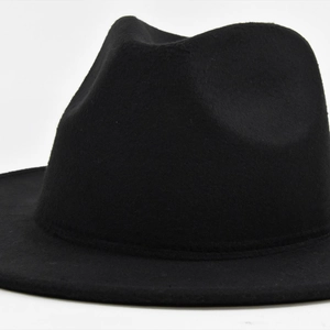 Close-up of the smooth black wool fedora hat showing elegant brim and crown texture