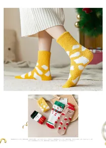 Detailed view of thick winter coral fleece socks with cute cartoon bear and snowman designs