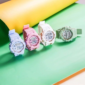 Detailed view of four digital sports watches in pastel blue, pink, white, and mint green