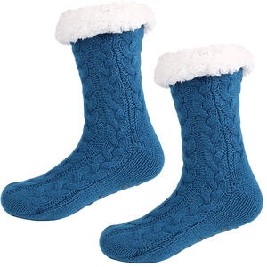 Blue knit slipper socks with thick white fleece lining and non-slip rubber dots
