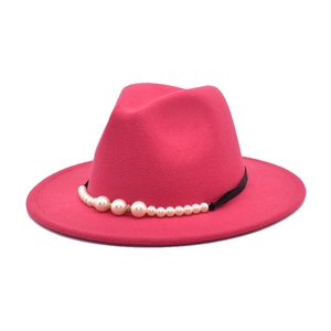 Magenta wide brim wool felt jazz hat featuring elegant pearl embellishments on black ribbon