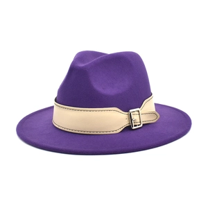 Detail of deep purple wool fedora hat featuring a beige leather band with metal buckle