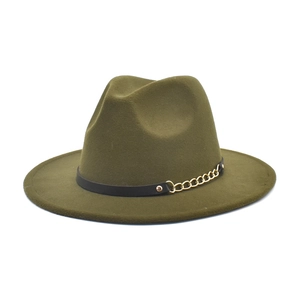 Detail of dark green felt fedora hat featuring a black leather band and gold chain link