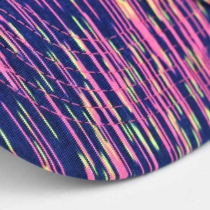 Detail of colorful pattern stitching and premium fabric on blue sun visor brim